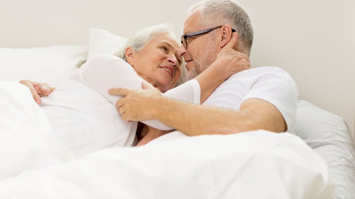 Mature couple in bed and men with increased potential